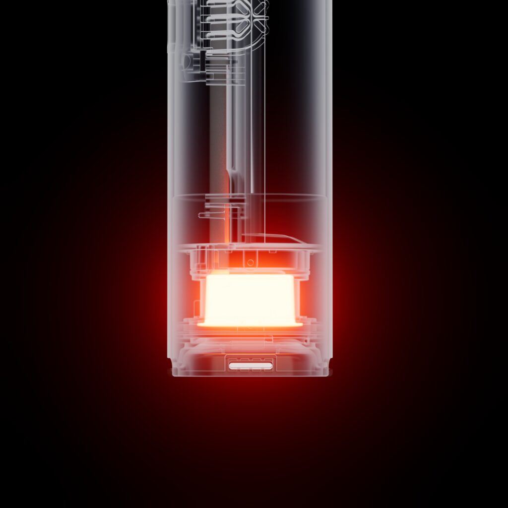 PAX FOUR: Analiza najnowszego waporyzatora od PAX 3 Przekrój wnętrza waporyzatora PAX FOUR ukazujący rozgrzany, hybrydowy system grzewczy o wysokiej mocy i komorę na susz.